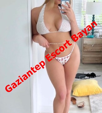 Woman in a white bikini taking a mirror selfie in a bright room; red diagonal text overlay reads 'Gaziantep Escort Bayan'. Woman in a white bikini taking a mirror selfie in a bright room; red diagonal text overlay reads 'Gaziantep Escort Bayan'.