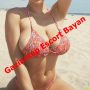 Woman in a pink bikini on a sunny beach, with bold red diagonal text reading 'Gaziantep Escort Bayan'. Woman in a pink bikini on a sunny beach, with bold red diagonal text reading 'Gaziantep Escort Bayan'.