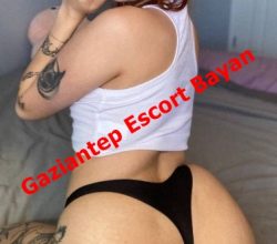 Advertisement image showing a woman in a white crop top and black thong posing on a bed, with red text 'Gaziantep Escort Bayan' across.