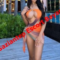 Woman in an orange-beige swimsuit posing by a pool at a resort; red diagonal text reads 'Gaziantep Escort Bayan'